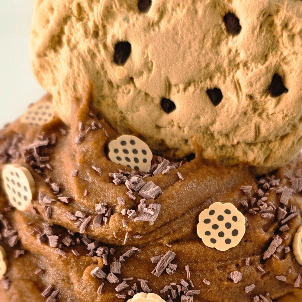 Close-up of the realistic cookie clay piece being mixed into the soft chocolate-scented cloud dough slime.