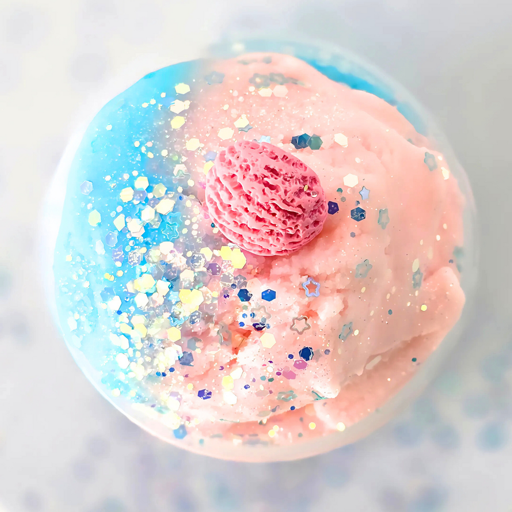 close up of a two colored cloud slime with sparkles and an ice cream charm on top