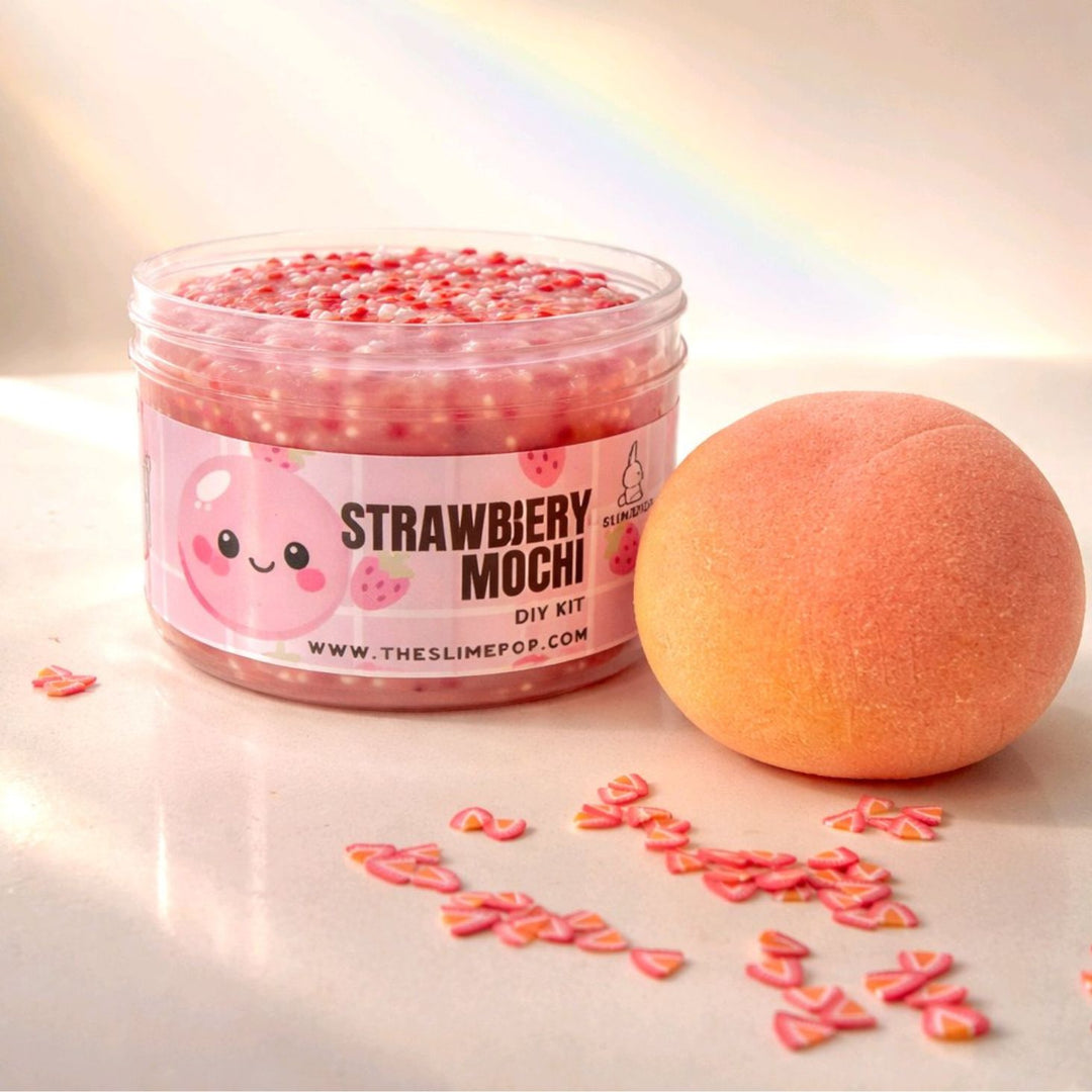 The complete DIY slime kit showing the 7oz jelly slime base, clay mochi piece, and  strawberry sprinkles