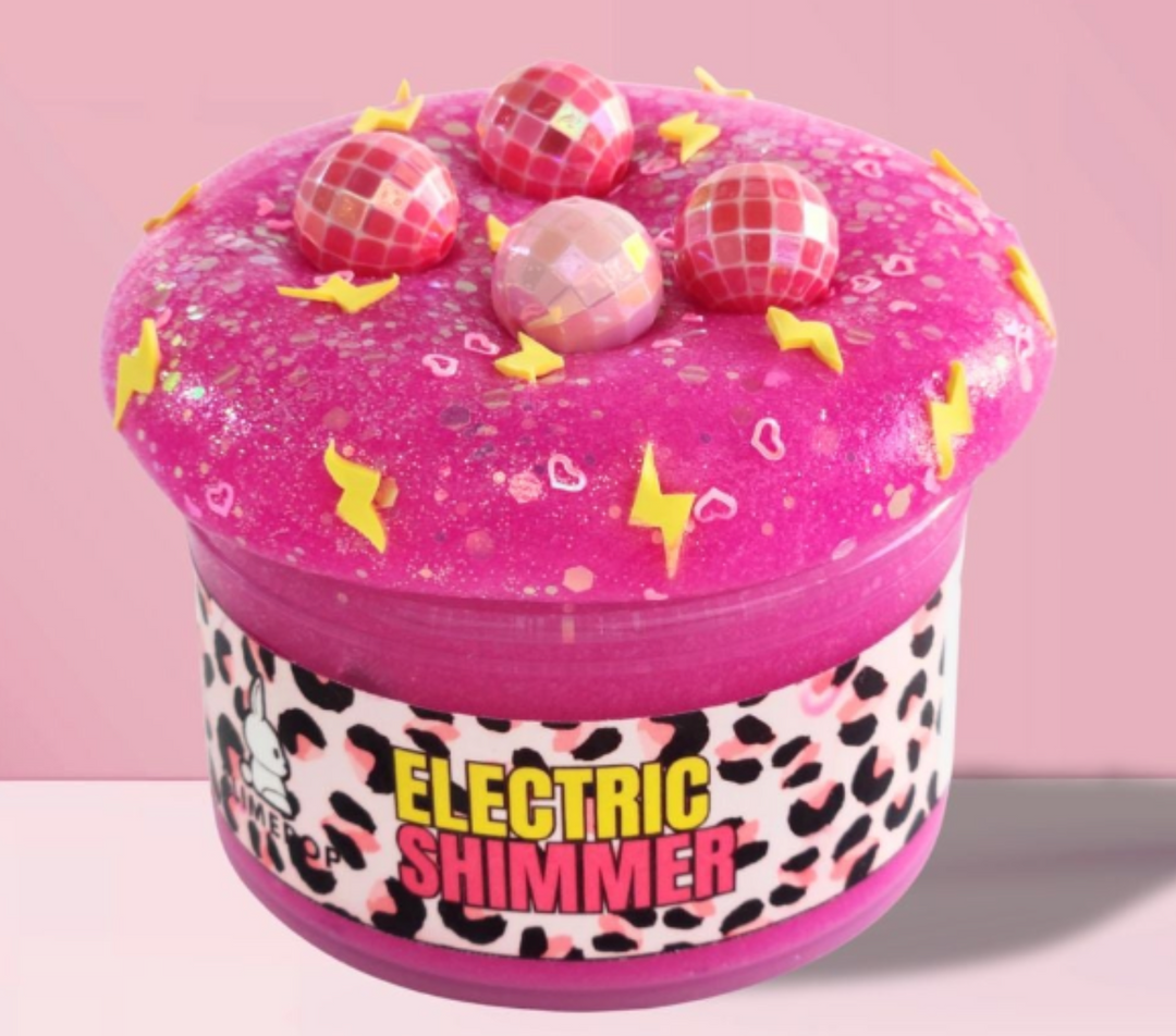 pink slime jar with name electric shimmer, disco ball charms and  yellow polymer slices
