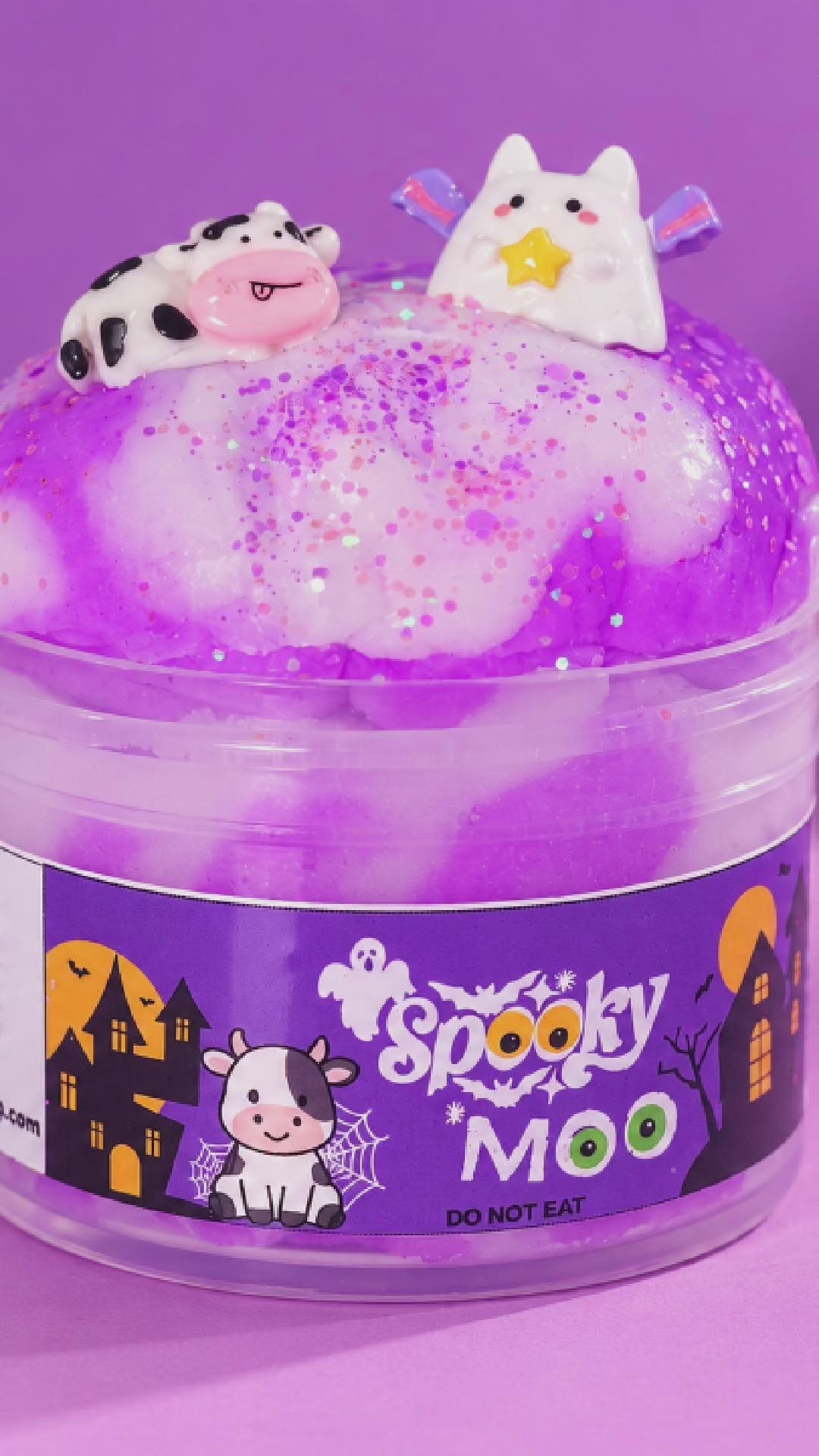 Spooky Moo Halloween cloud slime being stretched and drizzled to show its soft fluffy texture