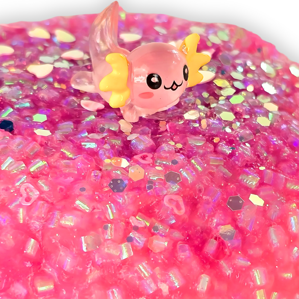 Macro shot of the pink Axolotl Dream bingsu slime showing the crunchy iridescent beads for satisfying ASMR pops.