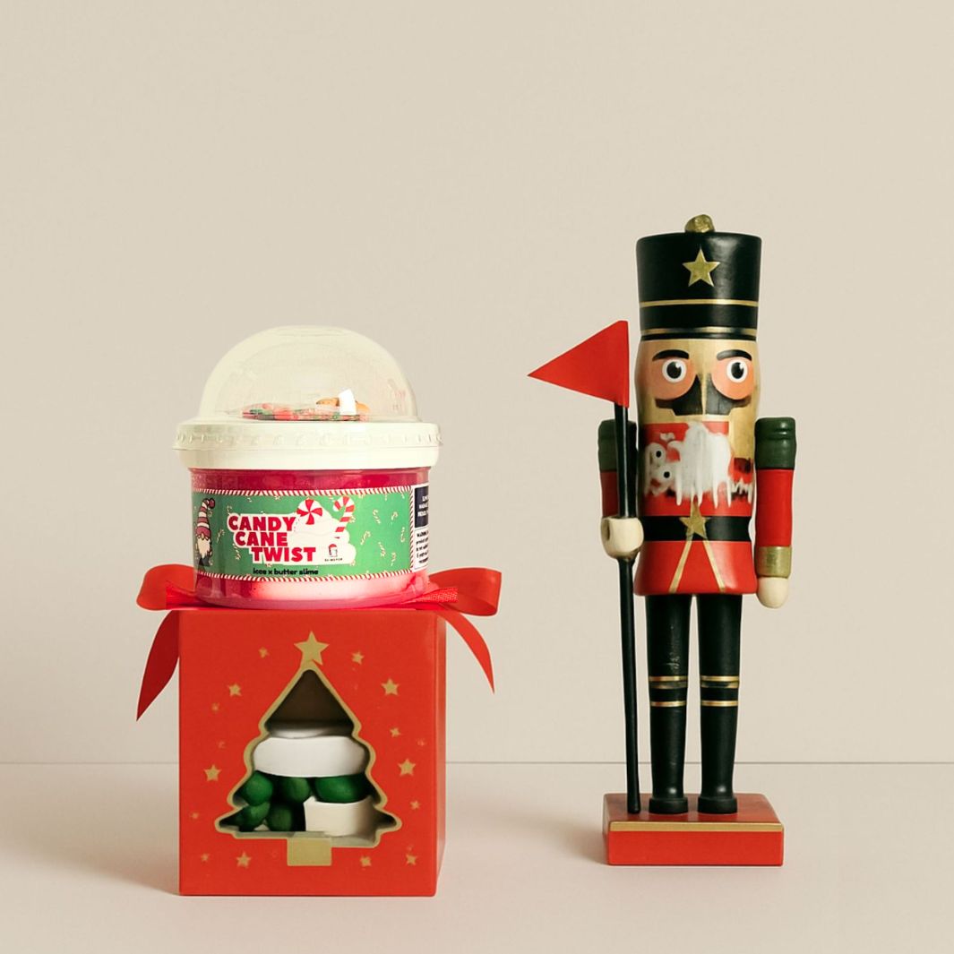 Secret Santa SlimePop holiday gift box featuring a choice of Christmas-themed slime, festive charms, and sprinkles, handmade in Dubai