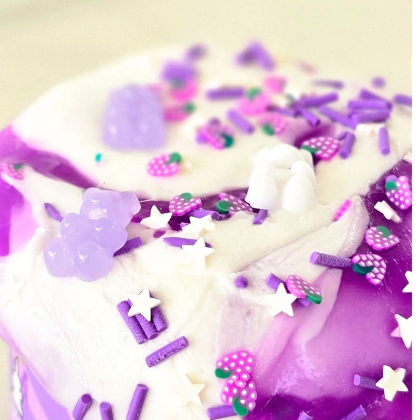 Close-up of a  scented purple and white jelly and glossy slime from slimepop dubai.