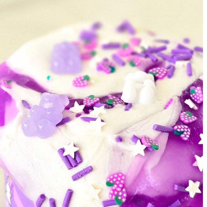 Close-up of a  scented purple and white jelly and glossy slime from slimepop dubai.