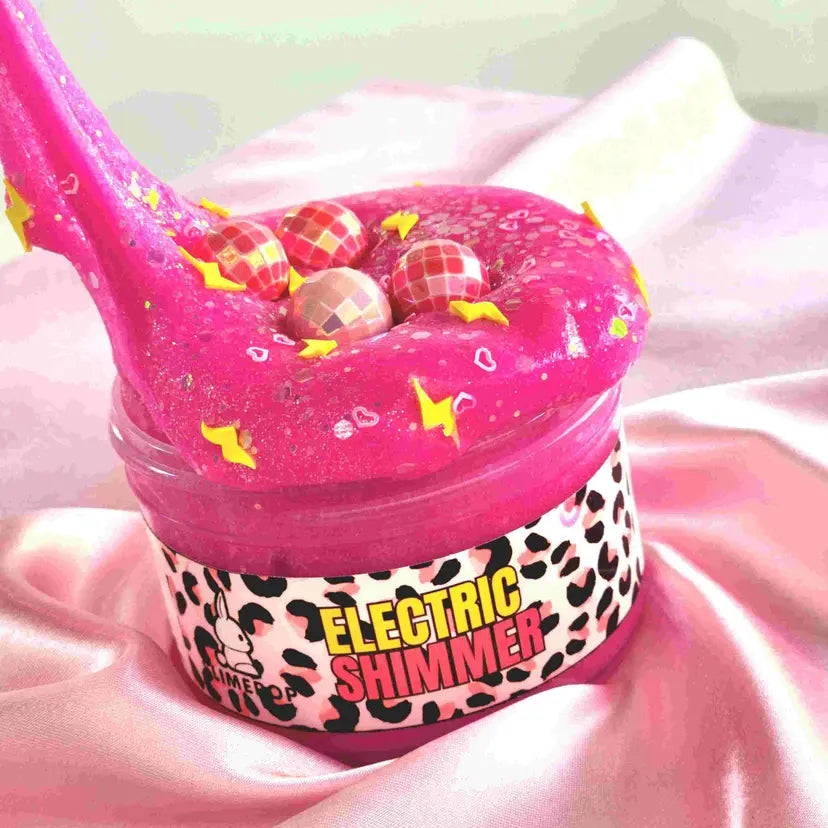 Pink slime container with 'Electric Shimmer' text on a pink background