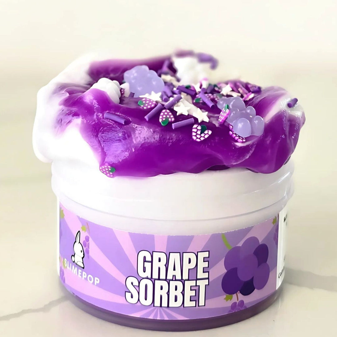 Slimepop Grape Sorbet jelly slime, a translucent purple clear slime with grape charms and the signature Slimepop bunny label, handcrafted in Dubai