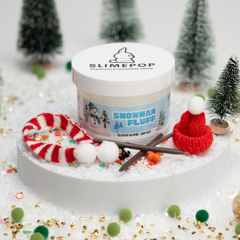 Slime pop container labeled 'Snowman Fluff' with festive decorations on a snowy background