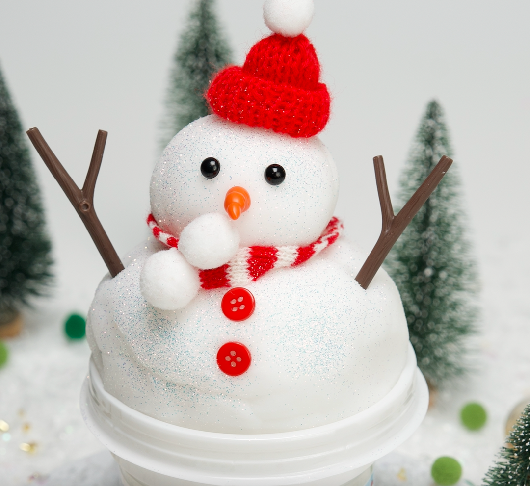 small snowman made out of cloud slime wearing red hat 