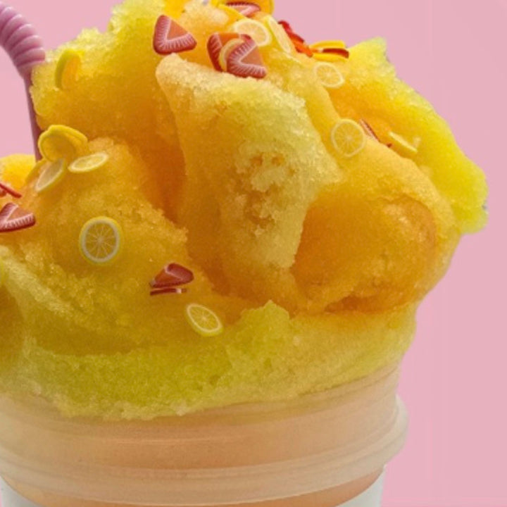 close up of strawberry lemonade icee slime with lemon and strawberry polymer slices